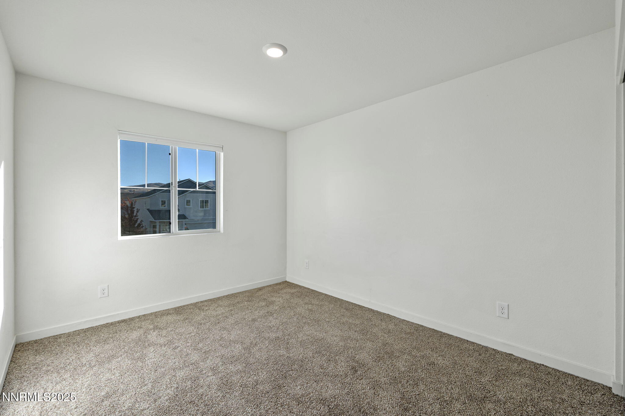 8791 Portia Drive Reno, NV 89506 - Photo 21 of 28 a view of an empty room with a window
