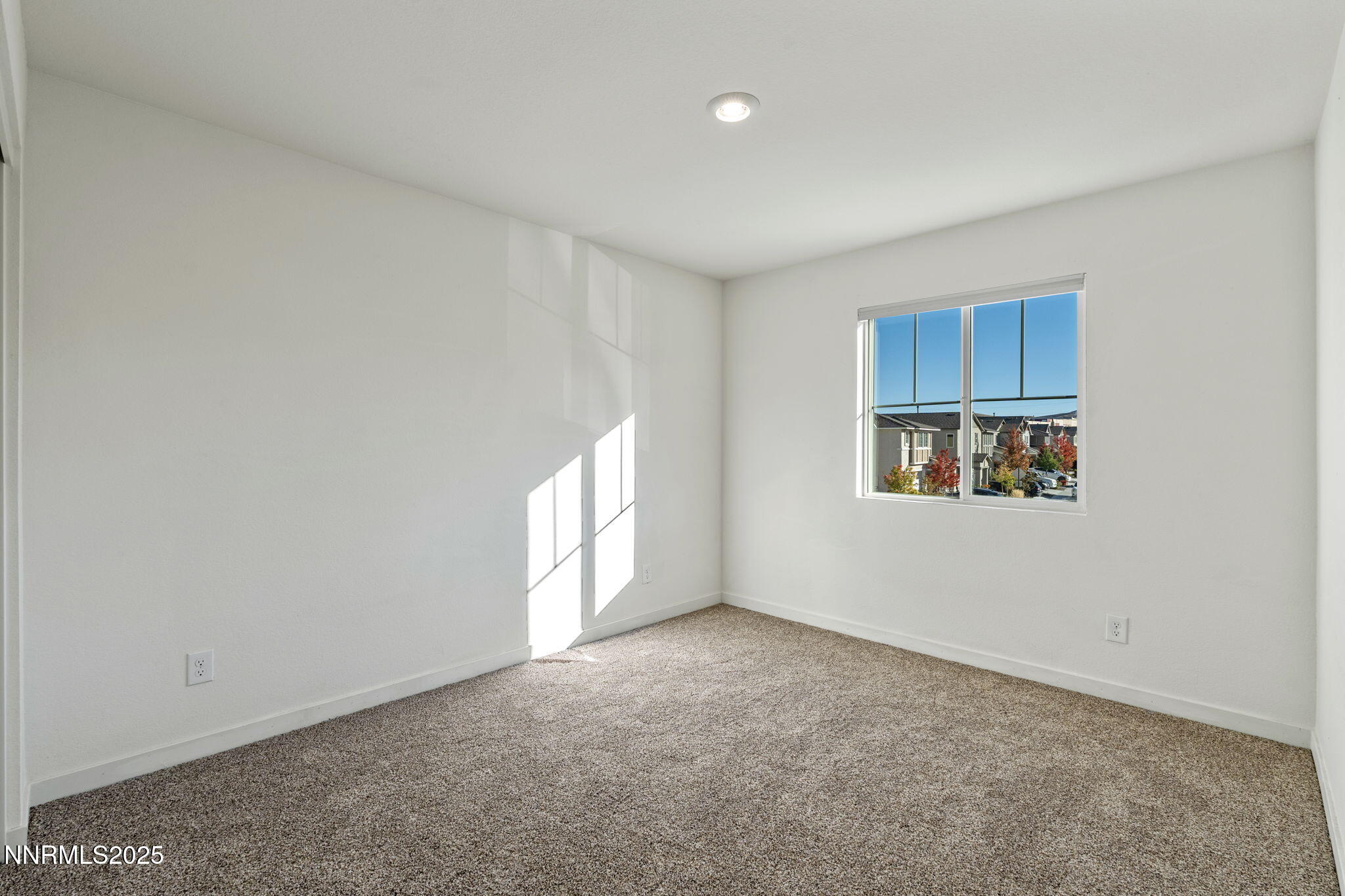 8791 Portia Drive Reno, NV 89506 - Photo 22 of 28 a view of an empty room with a window