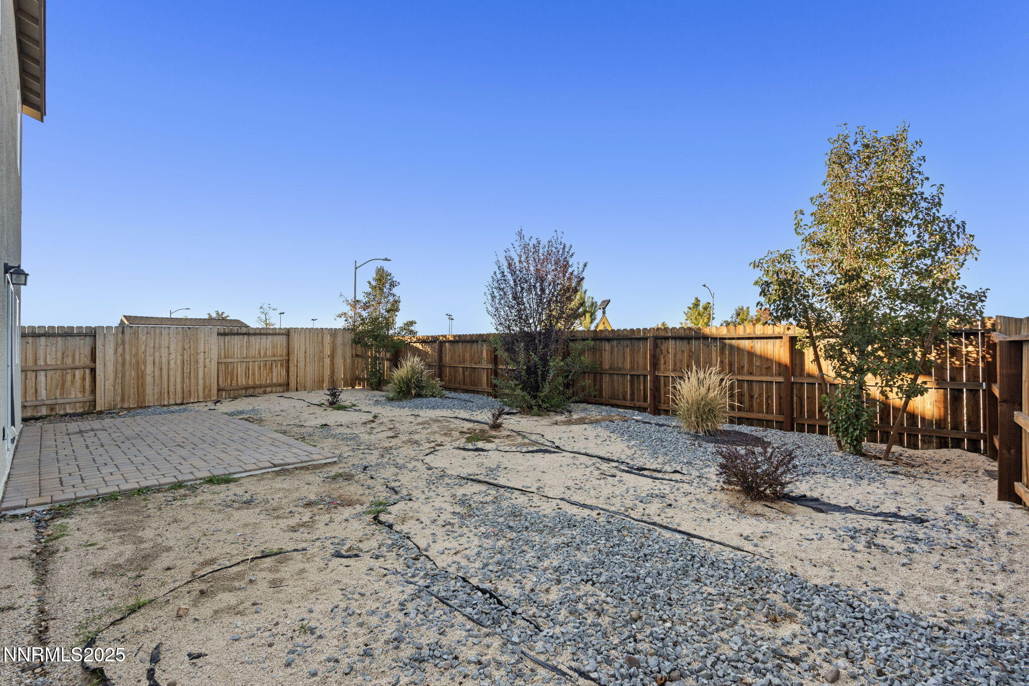 8791 Portia Drive Reno, NV 89506 - Photo 27 of 28 a backyard of a house with wooden fence