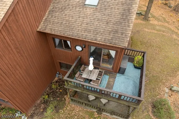 a living room with furniture a rug and a painting on the wall