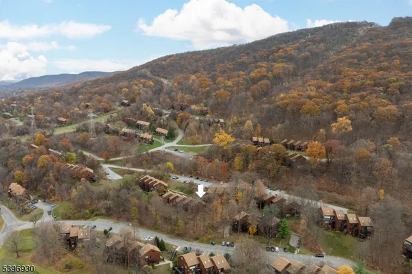 an aerial view of a house with outdoor space