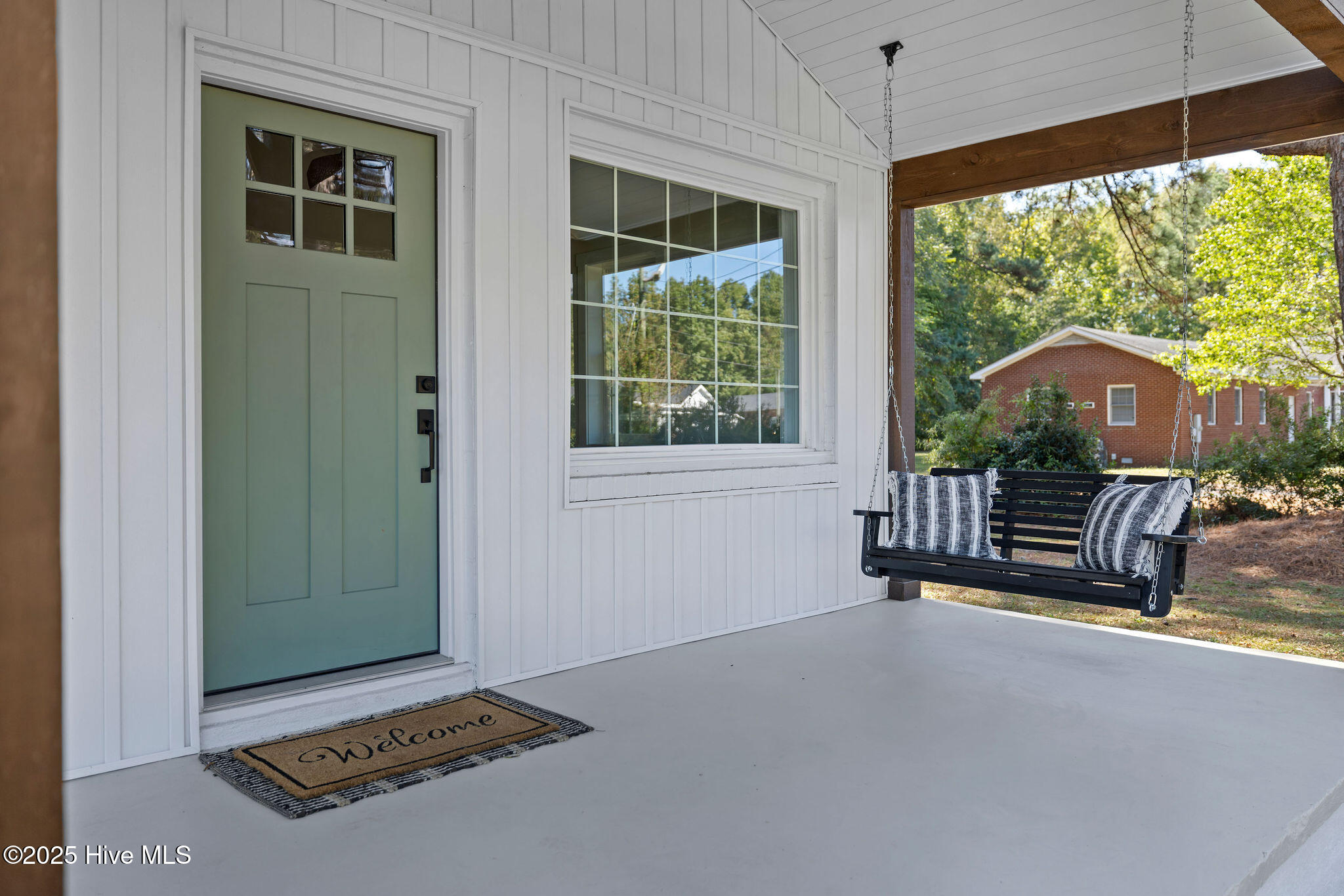 262 Millers Chapel Road Goldsboro, NC 27534 - Photo 7 of 64 custom built front porch swing- Brand new door and brand new large front window