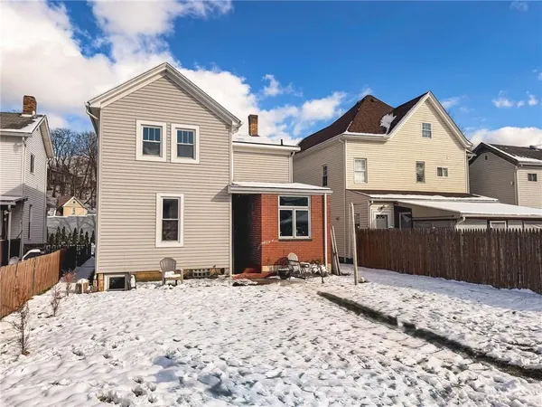 a view of a house with snow on the floor