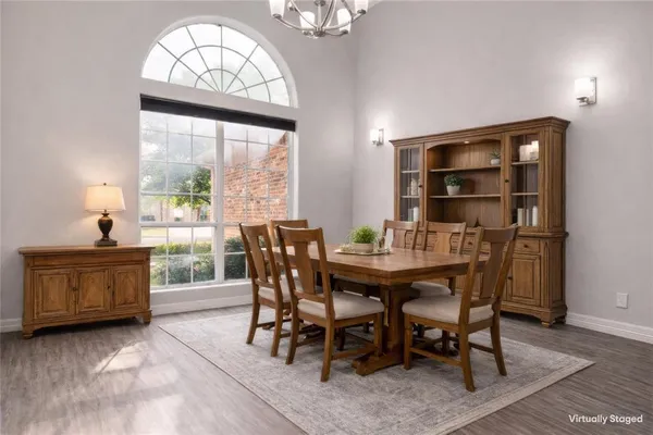 a view of a dining room with furniture window and outside view