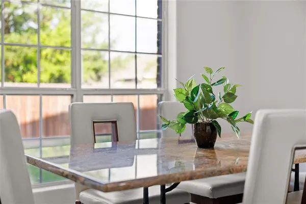 a view of living room with furniture and a potted plant