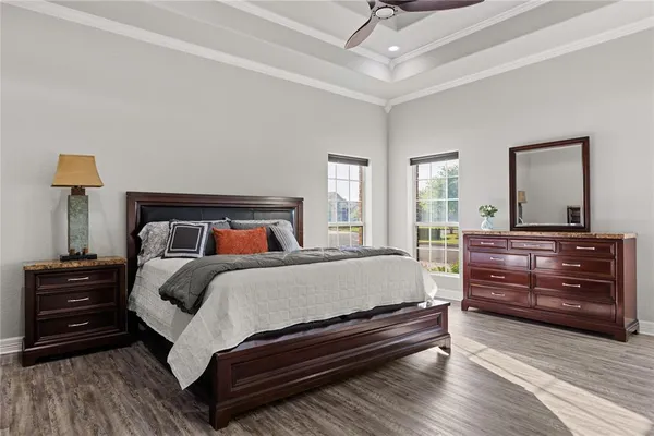 a bedroom with a bed and a dresser