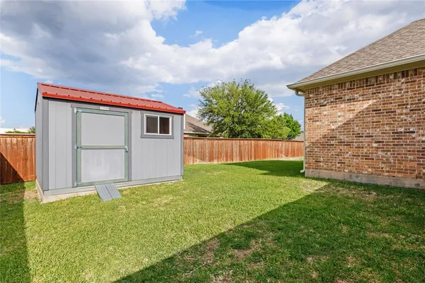 a backyard of a house with lots of green space