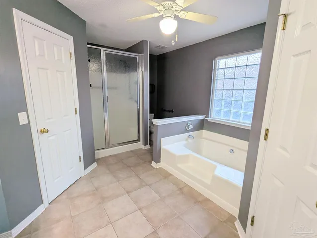 a bathroom with a tub and a shower