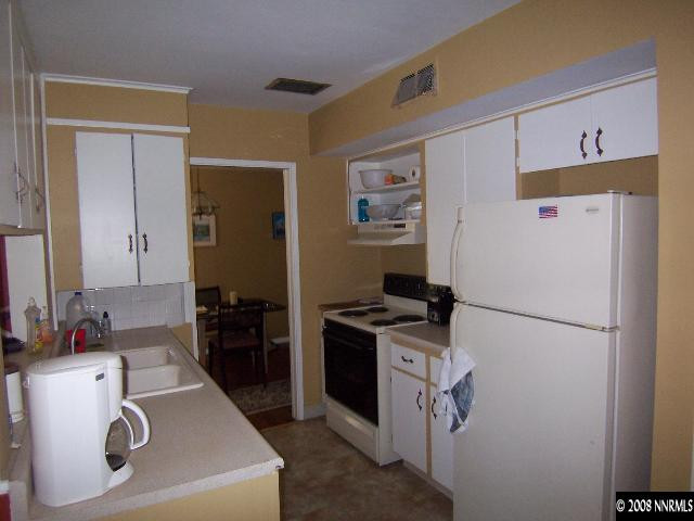 915 Primrose Street Reno, NV 89509 - Photo 2 of 9 a white refrigerator freezer sitting inside of a kitchen