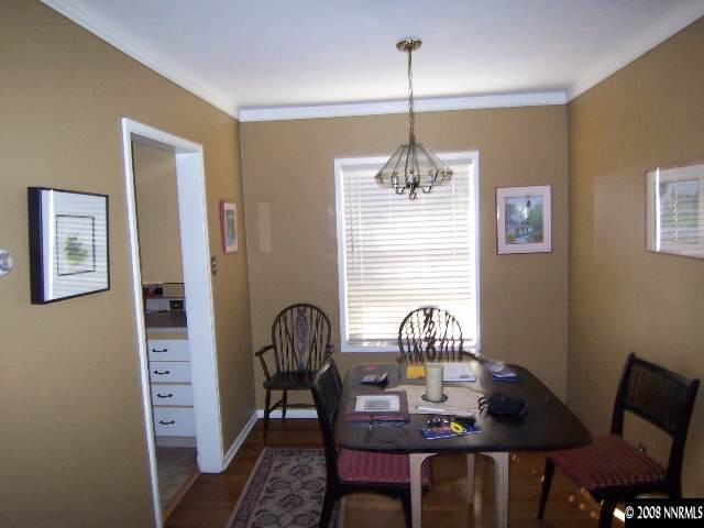 915 Primrose Street Reno, NV 89509 - Photo 3 of 9 a view of a dining room with furniture wooden floor and chandelier