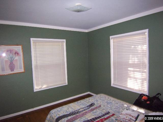 915 Primrose Street Reno, NV 89509 - Photo 7 of 9 a bedroom with a bed and a window