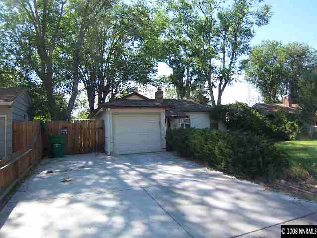 915 Primrose Street Reno, NV 89509 - Photo 8 of 9 a front view of a house with a garden