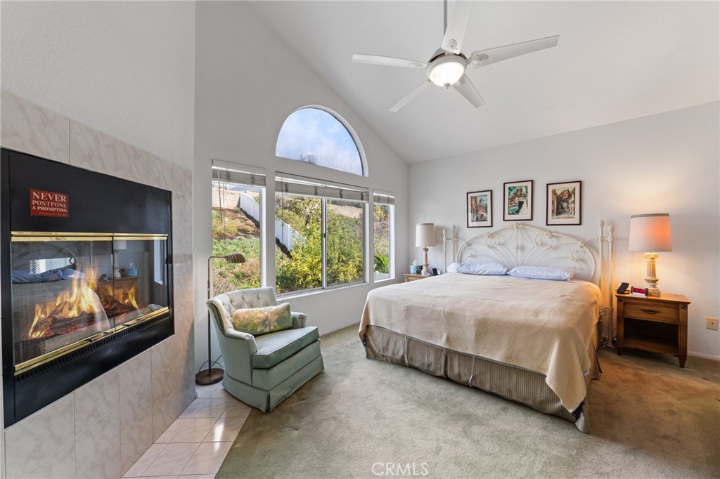 28962 Clear Spring Lane Highland, CA 92346 - Photo 12 of 32 a spacious bedroom with a bed and a flat screen tv