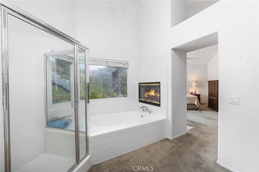 28962 Clear Spring Lane Highland, CA 92346 - Photo 14 of 32 a spacious bathroom with a bathtub and a shower