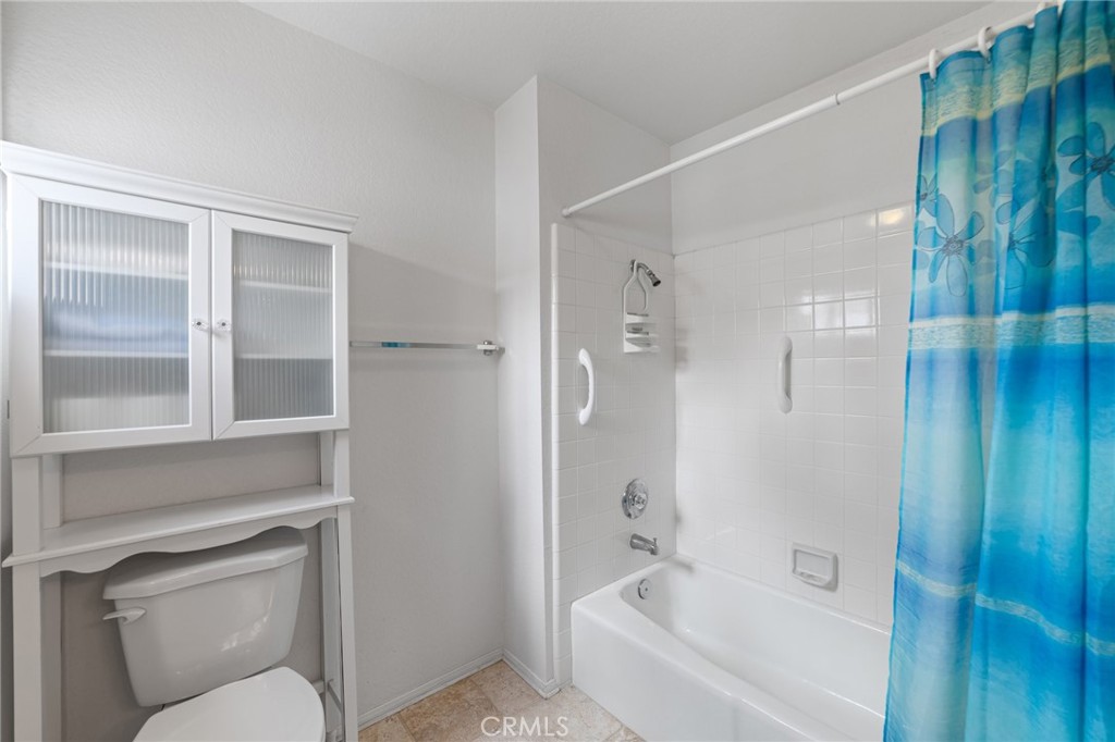 28962 Clear Spring Lane Highland, CA 92346 - Photo 19 of 32 a bathroom with a bathtub and shower