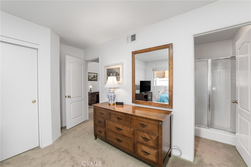 28962 Clear Spring Lane Highland, CA 92346 - Photo 24 of 32 a room with a dresser and a mirror