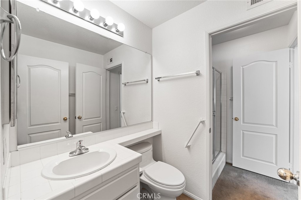 28962 Clear Spring Lane Highland, CA 92346 - Photo 25 of 32 a bathroom with a sink toilet and shower