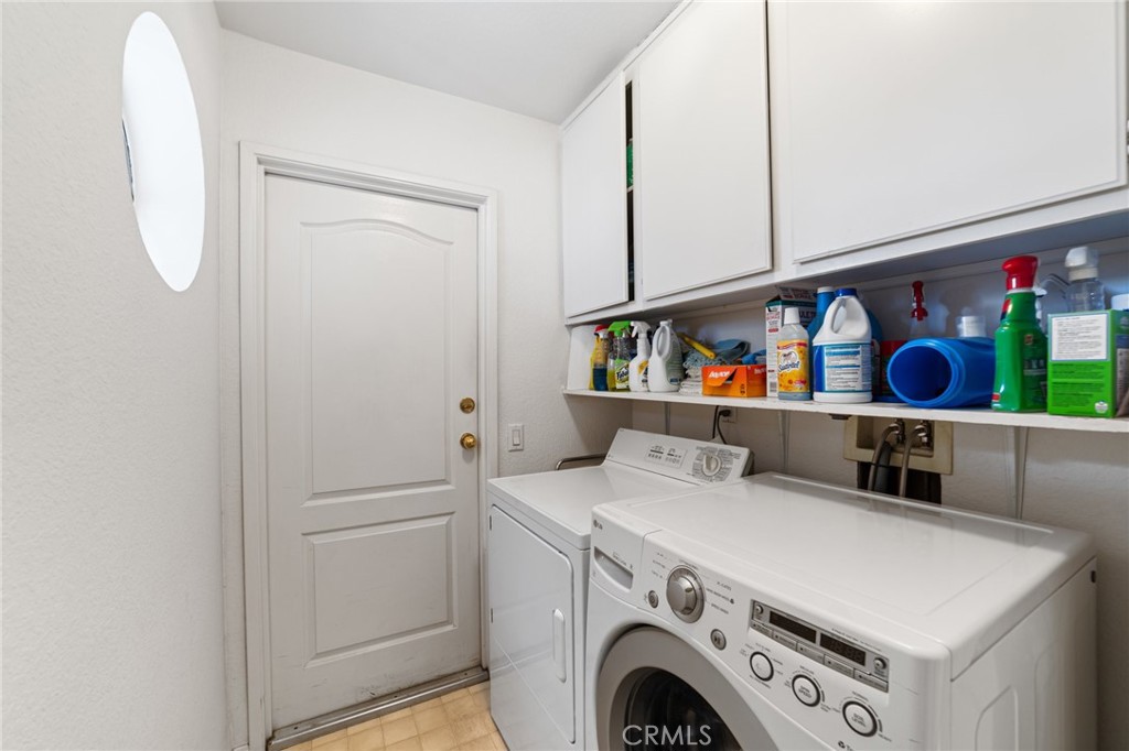 28962 Clear Spring Lane Highland, CA 92346 - Photo 26 of 32 a utility room with dryer and washer