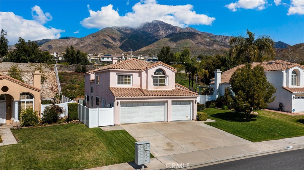 28962 Clear Spring Lane Highland, CA 92346 - Photo 32 of 32 a front view of a house with a yard and garage