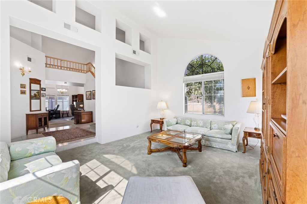 28962 Clear Spring Lane Highland, CA 92346 - Photo 7 of 32 a living room with furniture and a potted plant