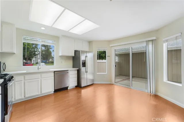a kitchen with stainless steel appliances a refrigerator and a sink