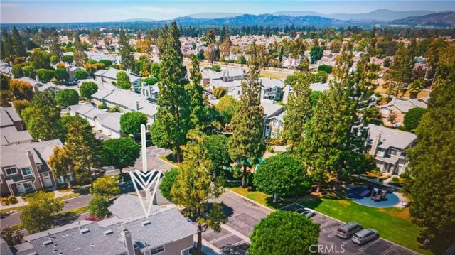 an aerial view of residential building and trees