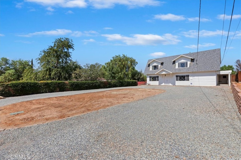 10555 Robinson Avenue Riverside, CA 92505 - Photo 11 of 65 a front view of a house with a yard