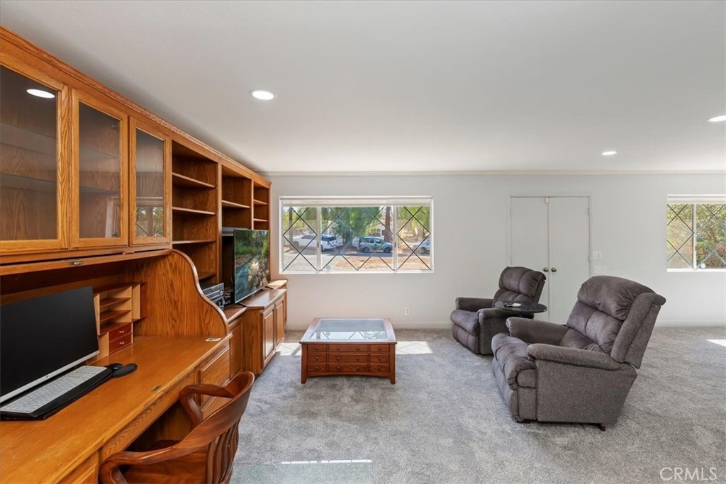 10555 Robinson Avenue Riverside, CA 92505 - Photo 22 of 65 a living room with furniture a flat screen tv and a window