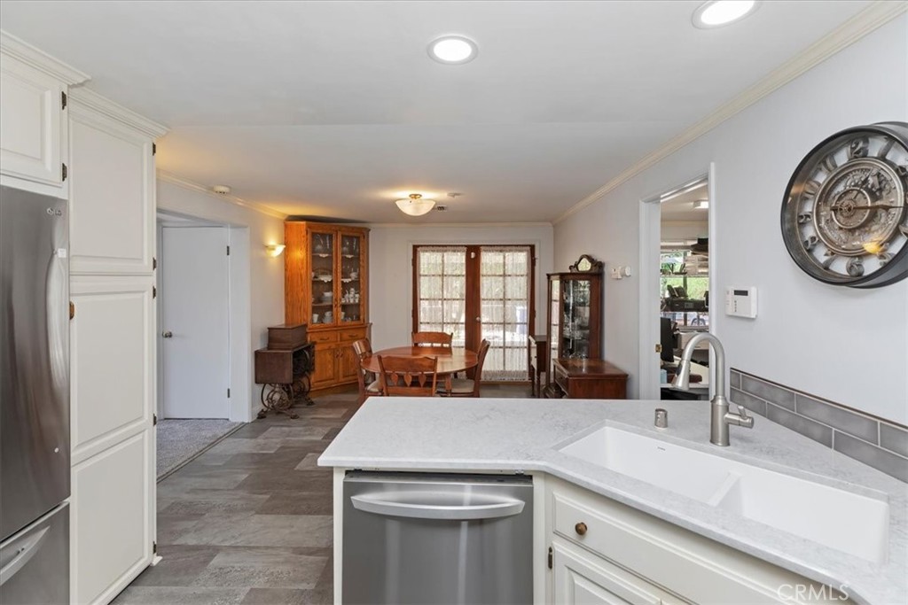 10555 Robinson Avenue Riverside, CA 92505 - Photo 28 of 65 a kitchen with a refrigerator and a sink