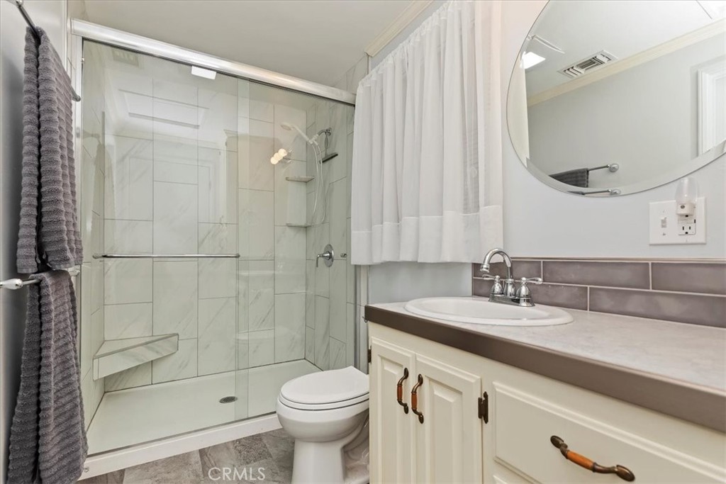 10555 Robinson Avenue Riverside, CA 92505 - Photo 34 of 65 a bathroom with a sink a toilet and shower