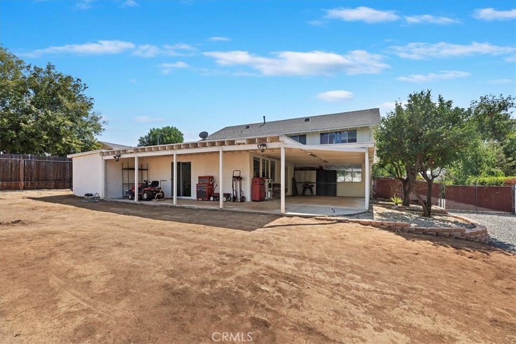 10555 Robinson Avenue Riverside, CA 92505 - Photo 51 of 65 a front view of a house with a yard and garage