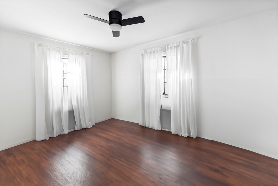 517 North Ave F Elgin, TX 78621 - Photo 11 of 21 an empty room with wooden floor and windows
