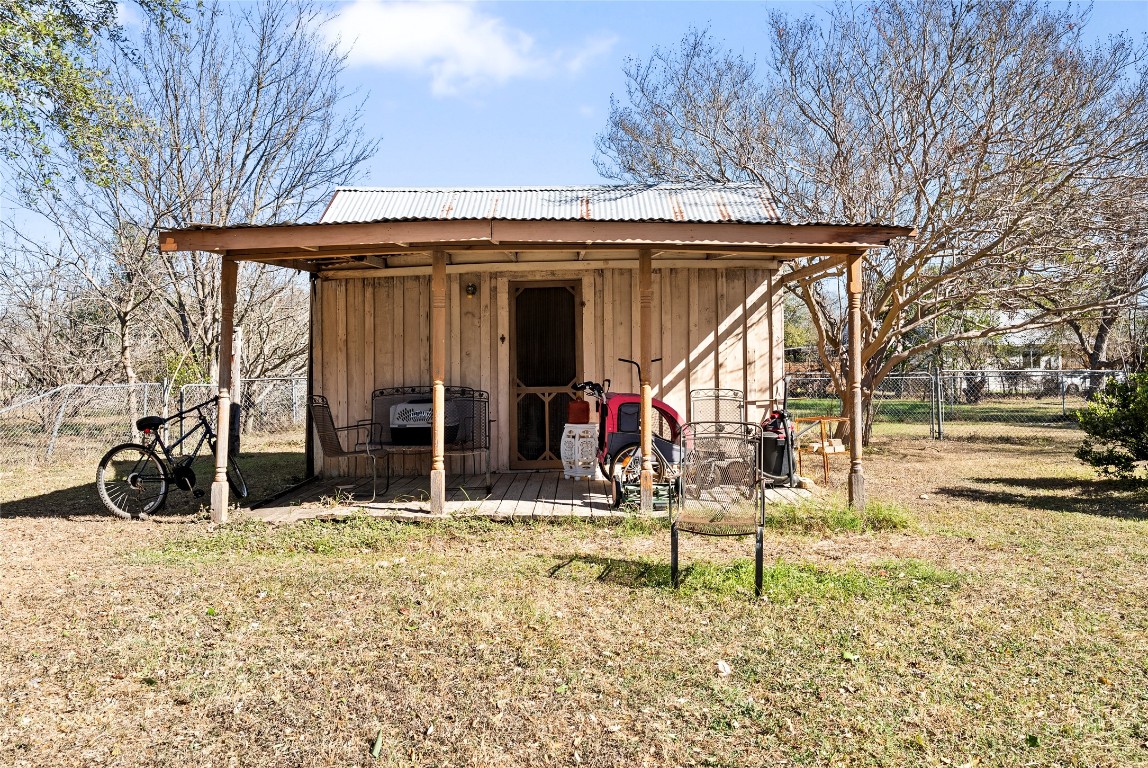 517 North Ave F Elgin, TX 78621 - Photo 19 of 21 a view of a chair and table in backyard of the house