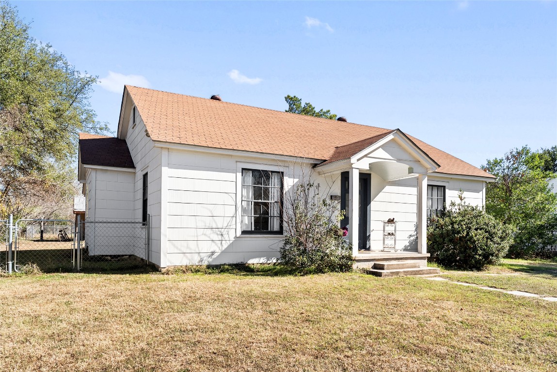 517 North Ave F Elgin, TX 78621 - Photo 4 of 21 a front view of a house with a yard and garage