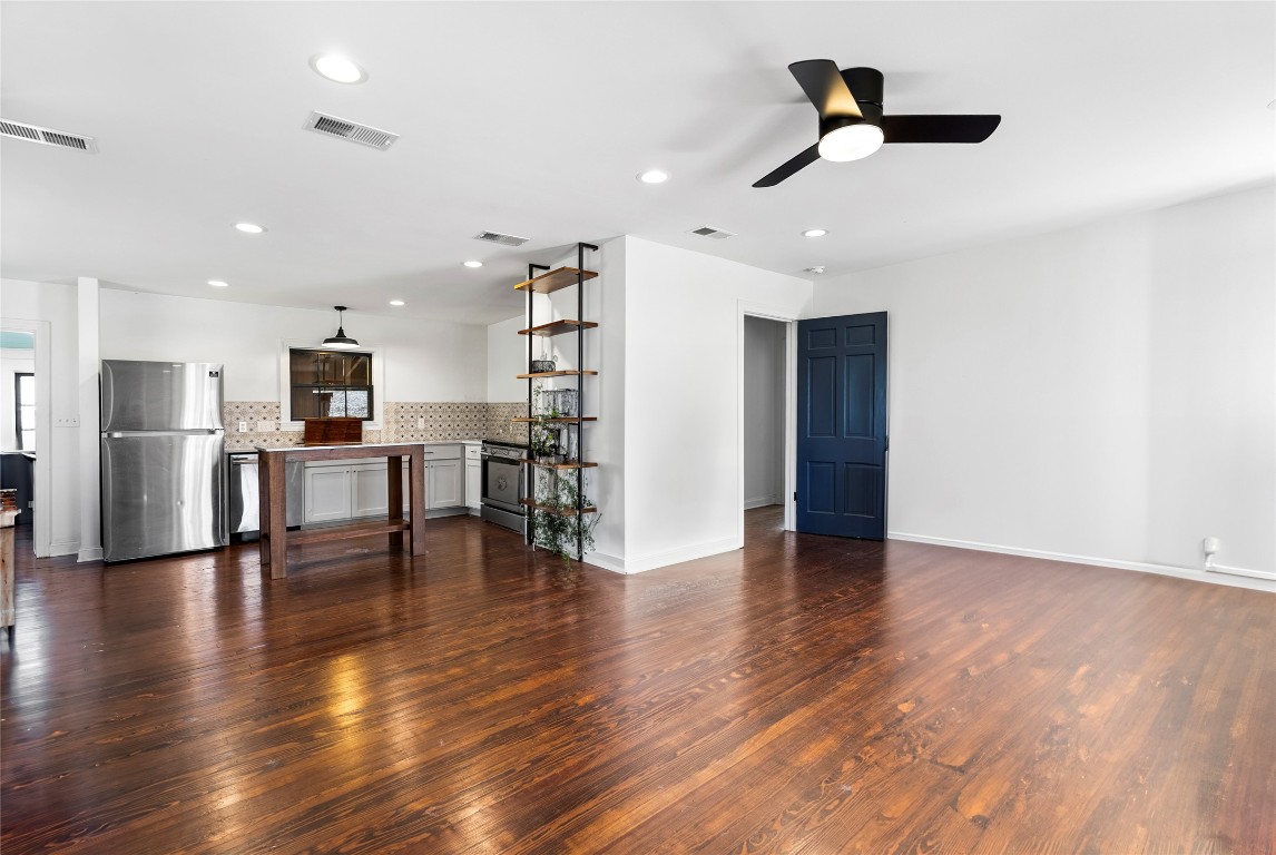 517 North Ave F Elgin, TX 78621 - Photo 8 of 21 a view of kitchen with stainless steel appliances refrigerator oven and stove