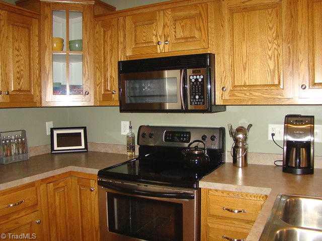 2591 Peppertree Ridge Road Randleman, NC 27317 - Photo 6 of 16 Kitchen. Smooth-top range & built-in microwave