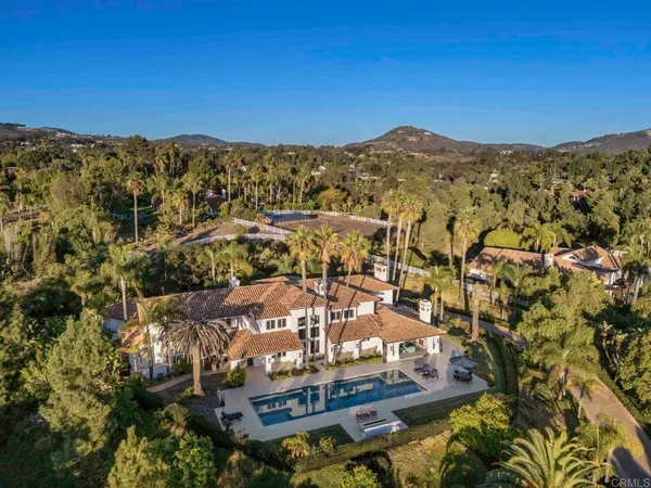 a view of a city with mountains in the background