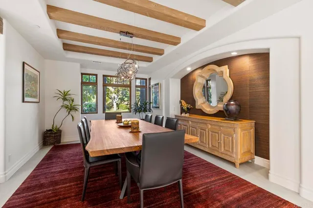 a large kitchen with a table and chairs in it