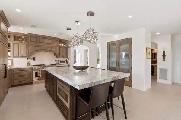 a kitchen with a table and chairs in it