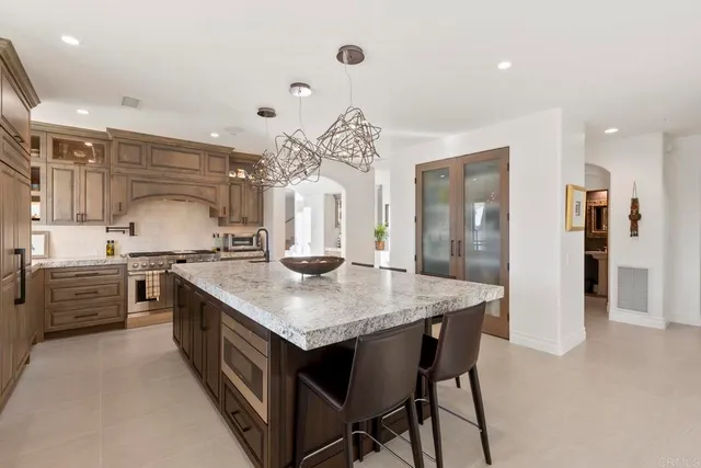 a kitchen with a table and chairs in it