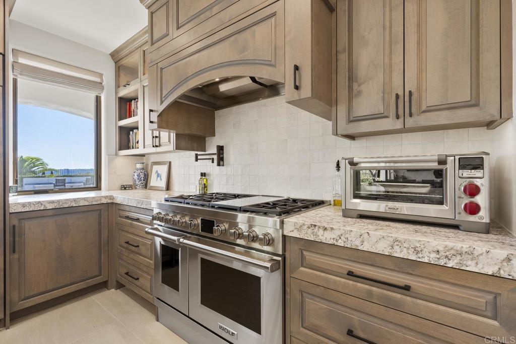 3226 Violet Ridge Encinitas, CA 92024 - Photo 18 of 54 a kitchen with granite countertop cabinets stainless steel appliances and a sink