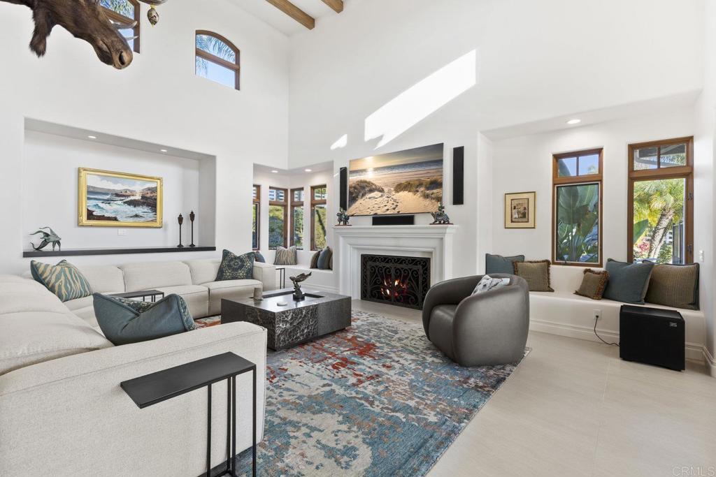 3226 Violet Ridge Encinitas, CA 92024 - Photo 19 of 54 a living room with furniture a flat screen tv and a fireplace