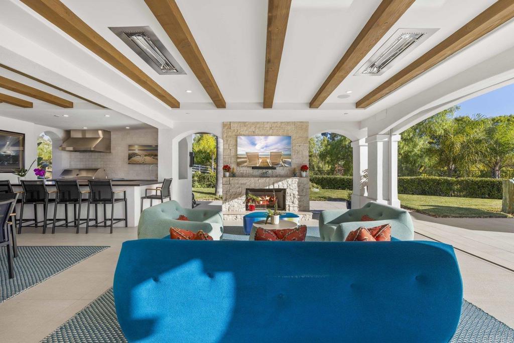 3226 Violet Ridge Encinitas, CA 92024 - Photo 22 of 54 a living room with furniture and a large window