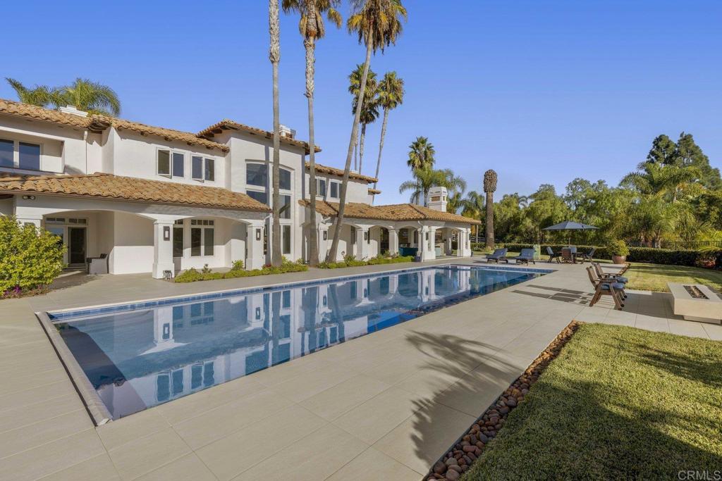 3226 Violet Ridge Encinitas, CA 92024 - Photo 26 of 54 a view of a swimming pool with a lounge chairs
