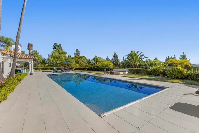 a view of a backyard with sitting area