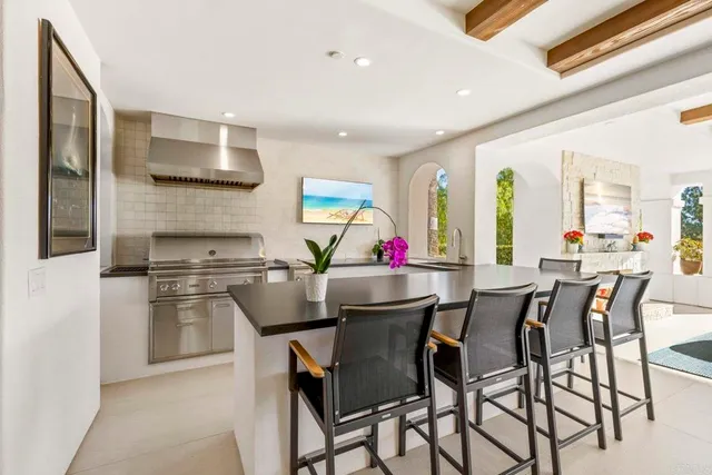 a kitchen with appliances cabinets and a window