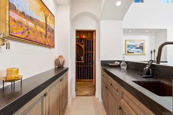 a view of a black door and a window