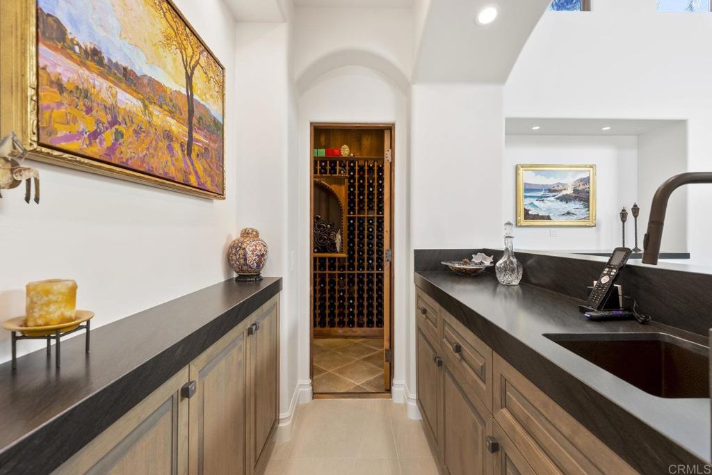 3226 Violet Ridge Encinitas, CA 92024 - Photo 35 of 54 a kitchen with a sink and cabinets