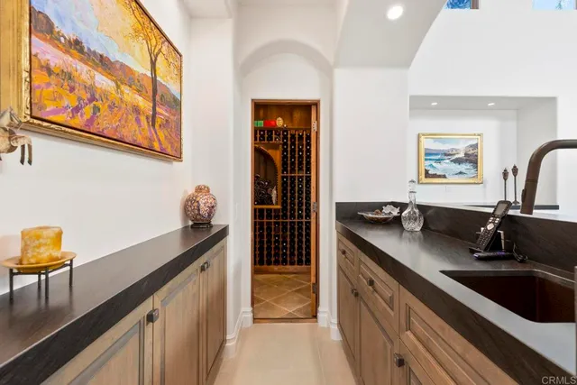 a view of a black door and a window