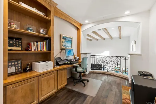 a spacious bedroom with a bed and a flat screen tv